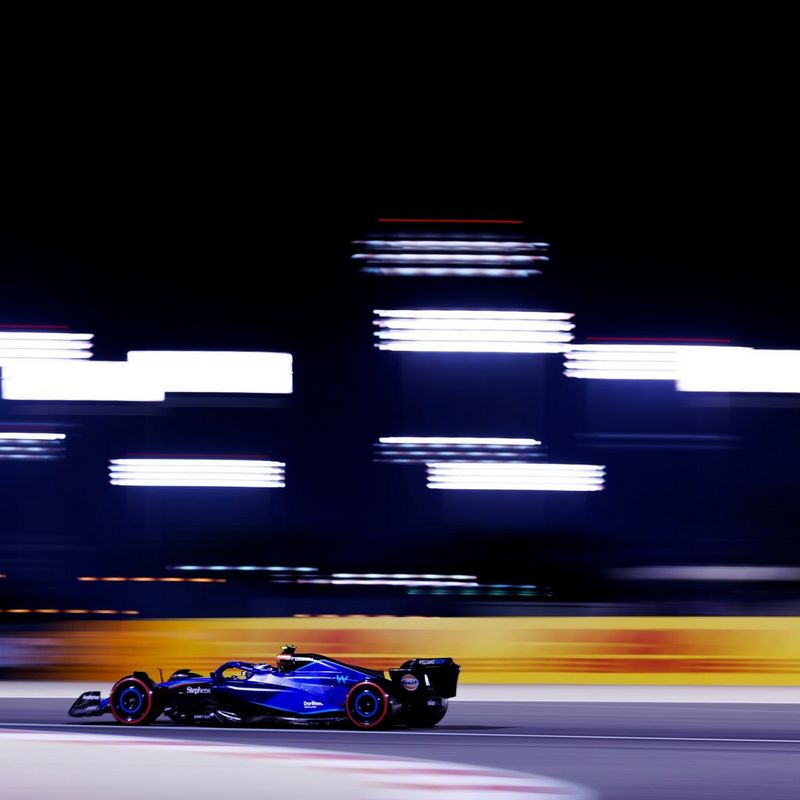 A Formula One racing car moving at speed is captured sharply against a blurred background in a photograph by Vladimir Rys using a Canon EOS R3 camera.