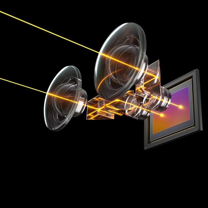 An illustration showing the path of light through the two lenses of a Canon RF 5.2mm F2.8L DUAL FISHEYE lens to the camera sensor.
