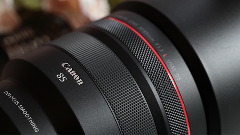 A close up image of a Canon lens RF 85mm F1.2L USM DS.