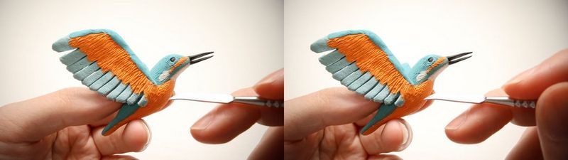 A composite image showing both the left-eye and right-eye view of hands crafting a colourful model of a bird, taken using a Canon RF-S 7.8mm F4 STM DUAL lens.