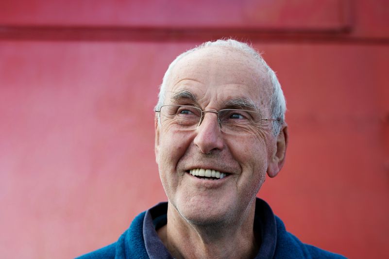A boat skipper looks at a notebook. 