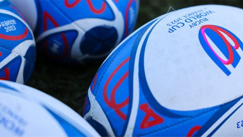 A close-up of rugby balls