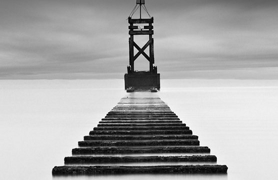smoky black and white pier