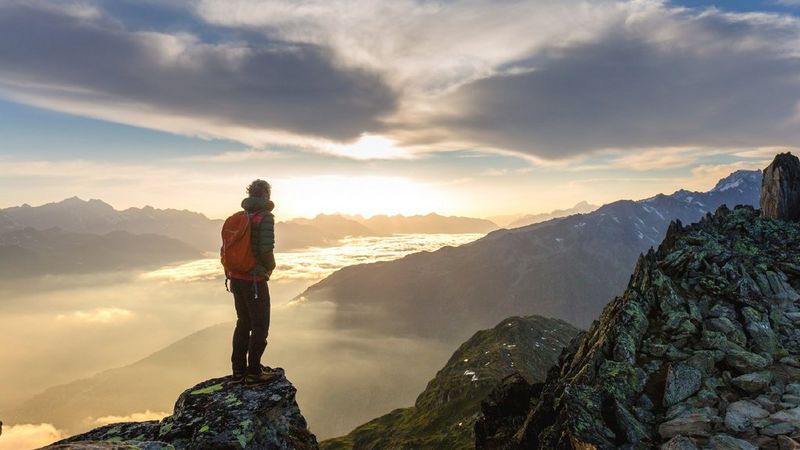 Sustainability competition 2 - man on top of mountain