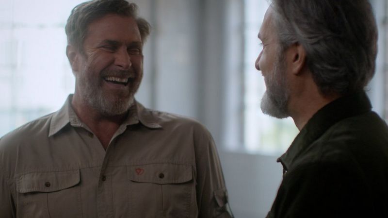 Brent Stirton laughing with Lawrence Gunther