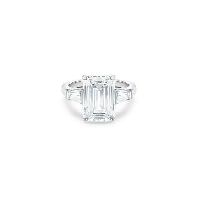 DB Classic solitaire ring with a large emerald-cut diamond and tapered baguette-cut side diamonds in platinum