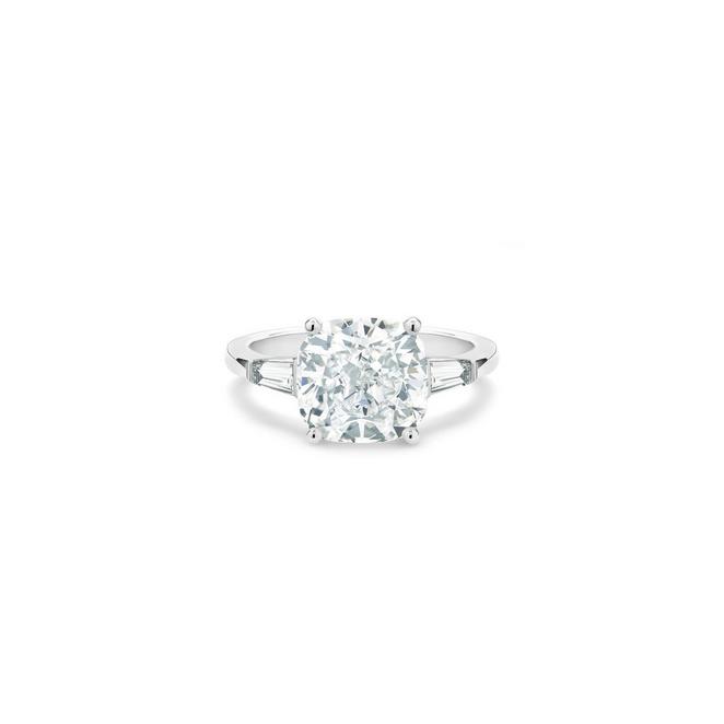 DB Classic solitaire ring with a large cushion-cut diamond and tapered baguette-cut side diamonds in platinum