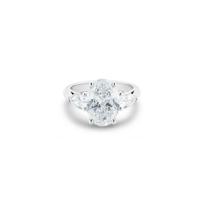 DB Classic solitaire ring with a large oval-shaped diamond and pear-shaped side diamonds in platinum
