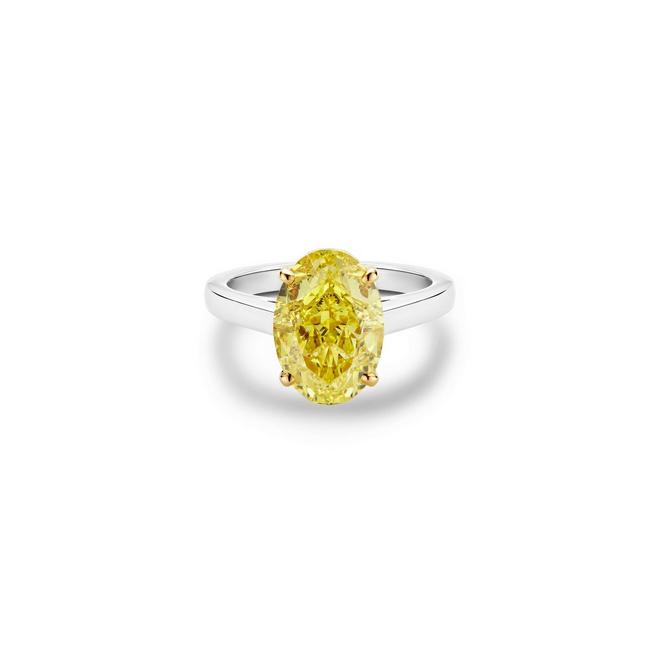 DB Classic solitaire ring with a fancy yellow oval-shaped diamond in yellow gold and platinum