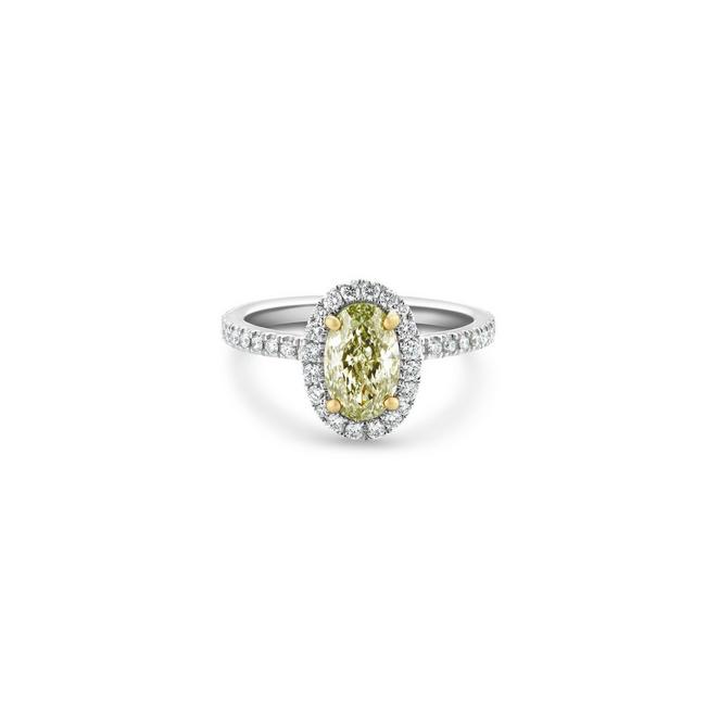 Aura solitaire ring with a fancy colour oval-shaped diamond in platinum and yellow gold