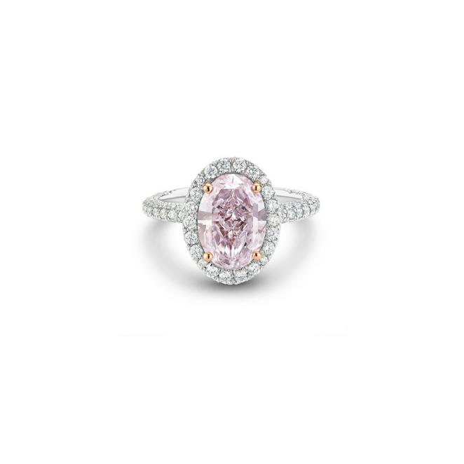 Aura solitaire ring with a fancy colour oval-shaped diamond in platinum
