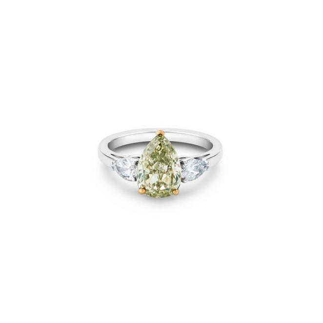 DB Classic solitaire ring with a fancy colour pear-shaped diamond and pear-shaped side diamonds in platinum and yellow gold