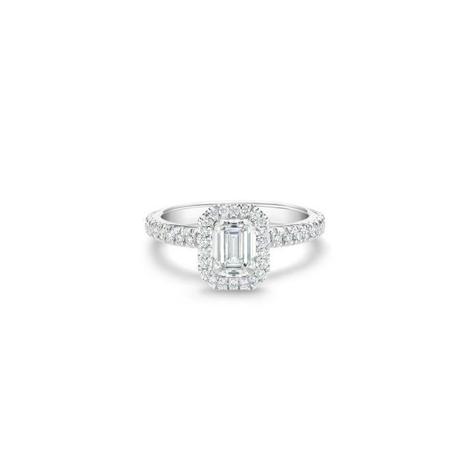 Aura solitaire ring with an emerald-cut diamond in platinum