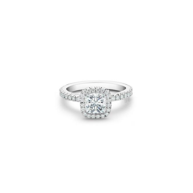 Aura solitaire ring with a cushion-cut diamond in platinum