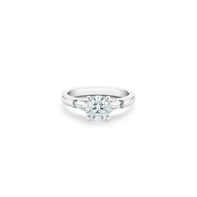 DB Classic solitaire ring with a round brilliant diamond and tapered baguette-cut side diamonds in platinum