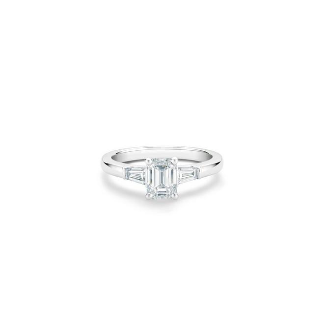 DB Classic solitaire ring with an emerald-cut diamond and tapered baguette-cut side diamonds in platinum