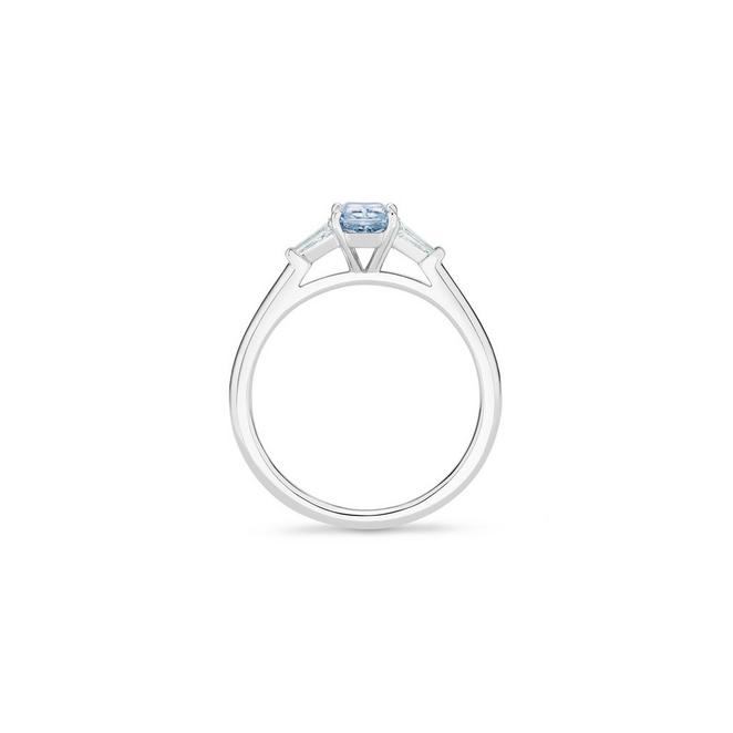 DB Classic solitaire ring with a fancy intense blue radiant-cut diamond and tapered baguette-cut side diamonds in platinum