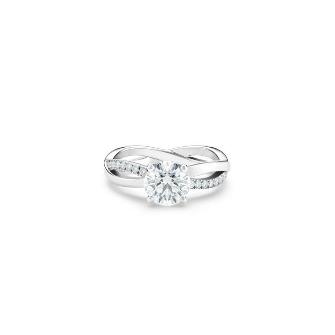 Infinity solitaire ring with a round brilliant diamond in platinum
