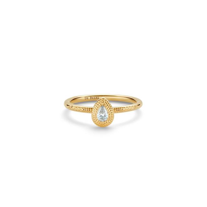 Talisman stacking ring with a pear-shaped diamond in yellow gold