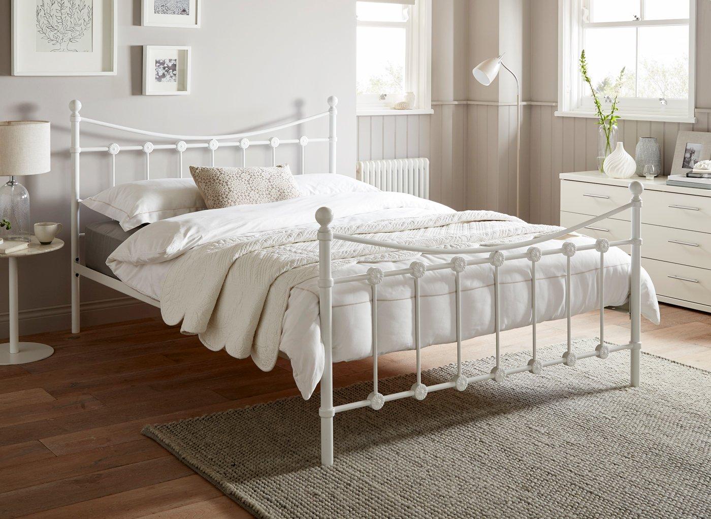 White metal bed store frame double