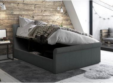 Bed frame against a wooden wall with ottoman lift open