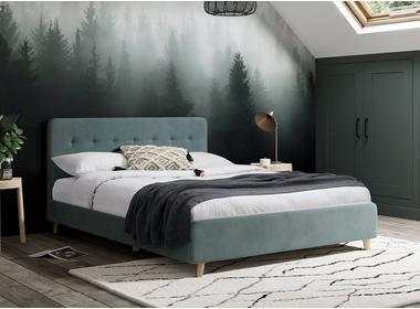 A bed frame against the wall with a window frame