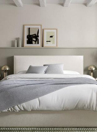 Bed frame against a wall with window frame