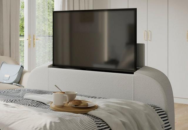 TV screen in footend of bed