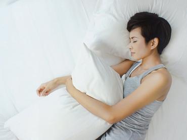 Women sleeping on bed