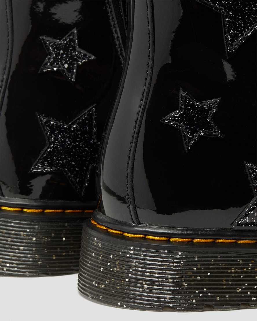 https://i1.adis.ws/i/drmartens/27060001.88.jpg?$large$Youth 1460 Glitter Star Patent Lace UpBoots | Dr Martens