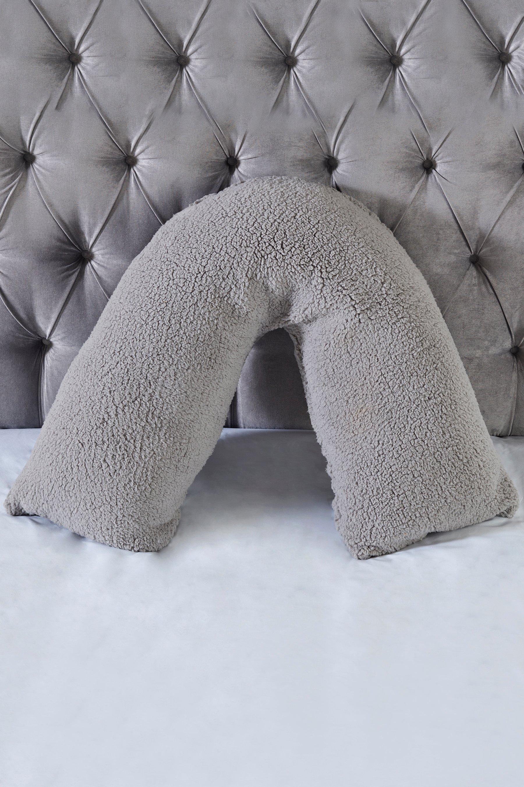 grey v shaped pillow