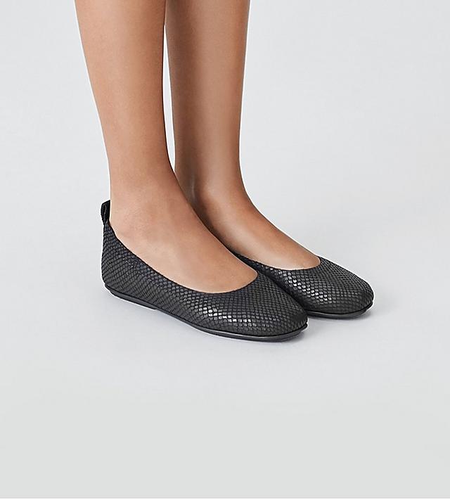 Fitflop Leather Ballerinas with snake-print textured material in black.