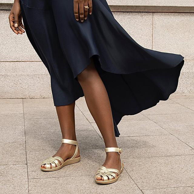 Fitflop weave leather closed toe sandals with back-strap in gold.