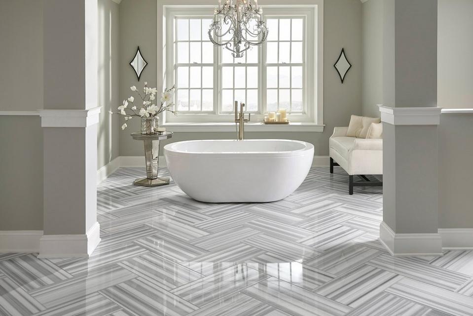 https://i1.adis.ws/i/flooranddecor/100054220_marble-skyfall-gray-polished-bathroom-floor-herringbone_room?w=959&fmt=jpg&fmt.jpeg.interlaced=true&qlt=70
