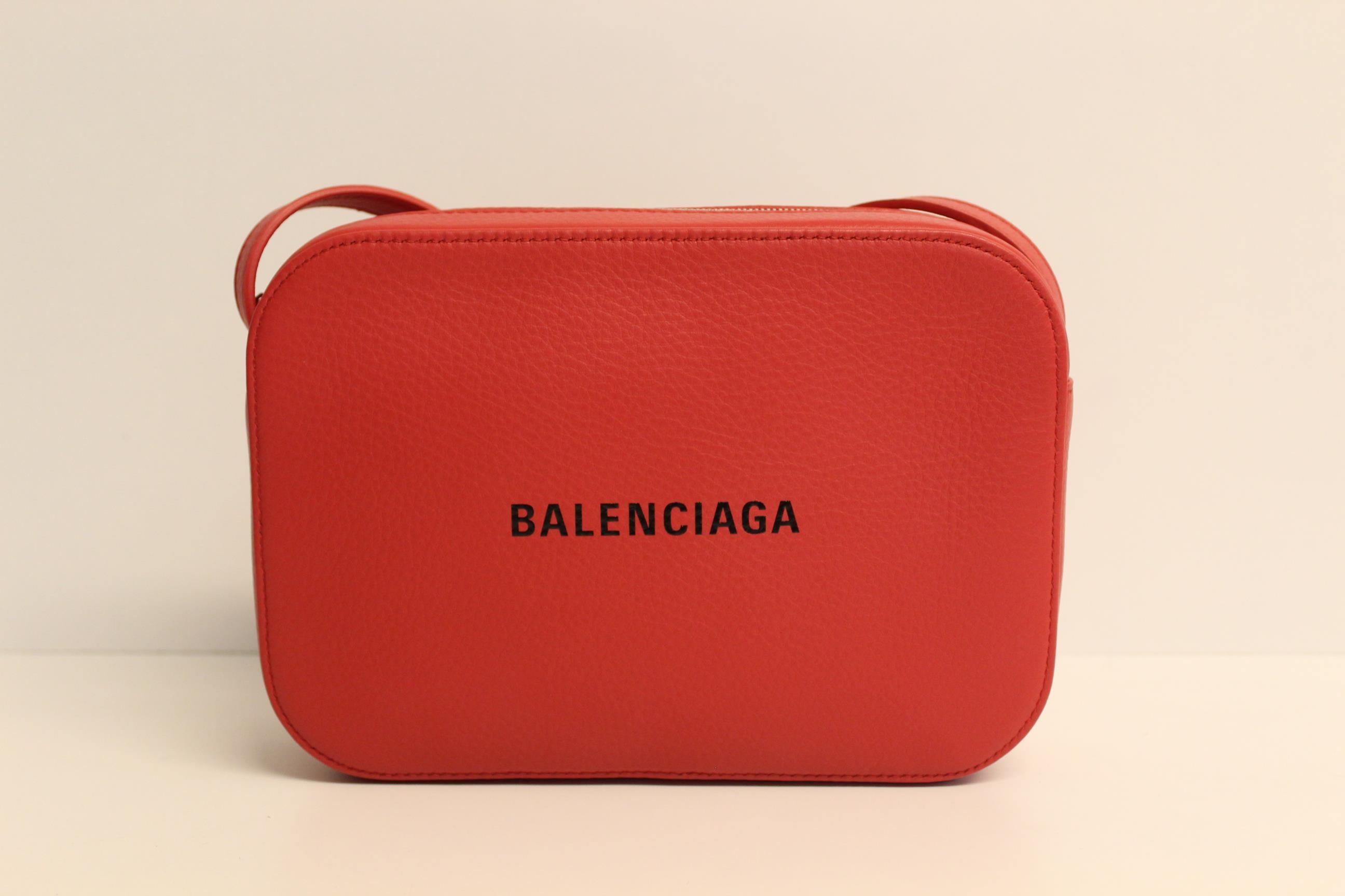 red leather camera bag