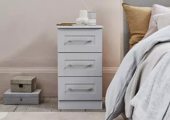 Gray Twin Bed with Brass and Marble Nesting Bedside Tables