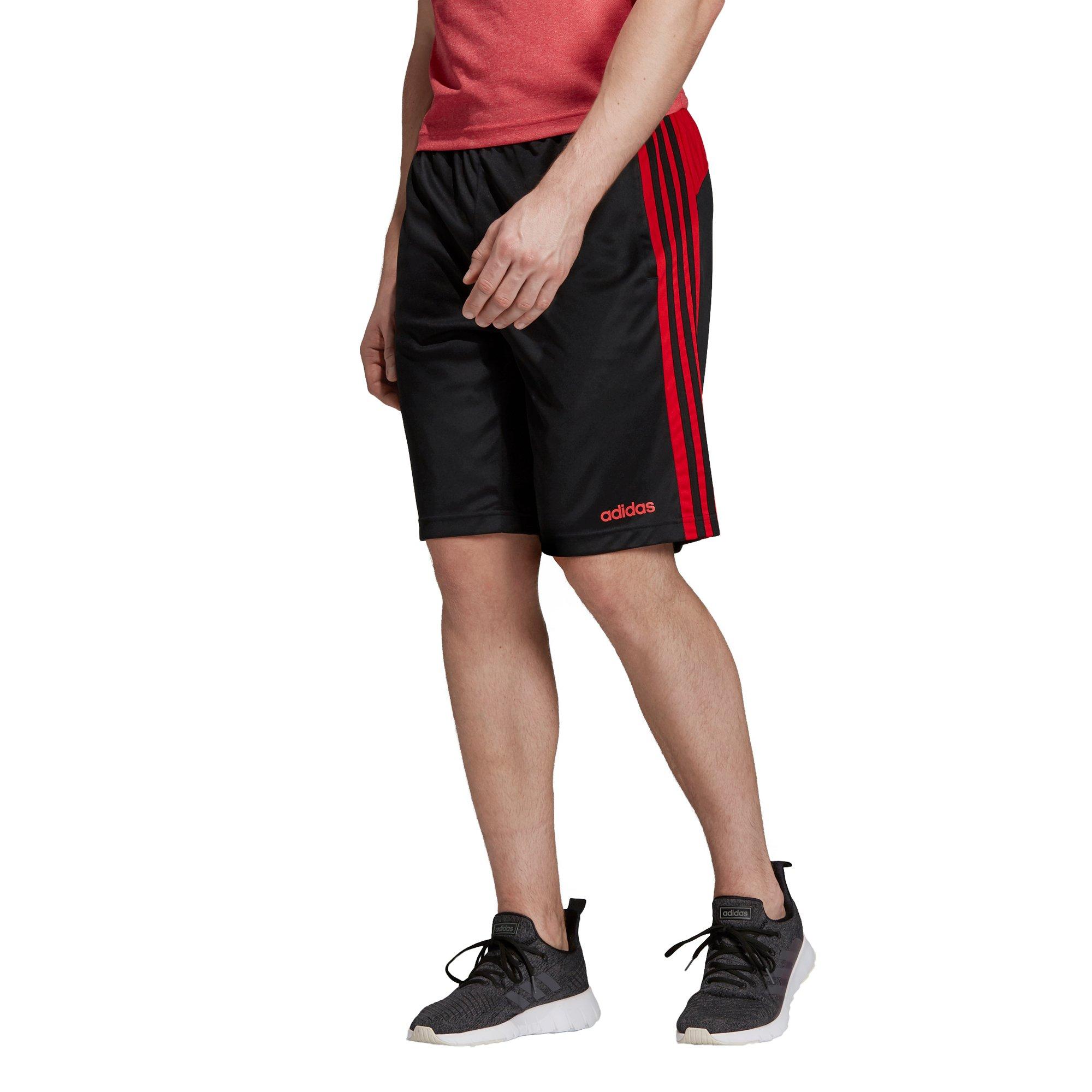 black adidas shorts with red stripes