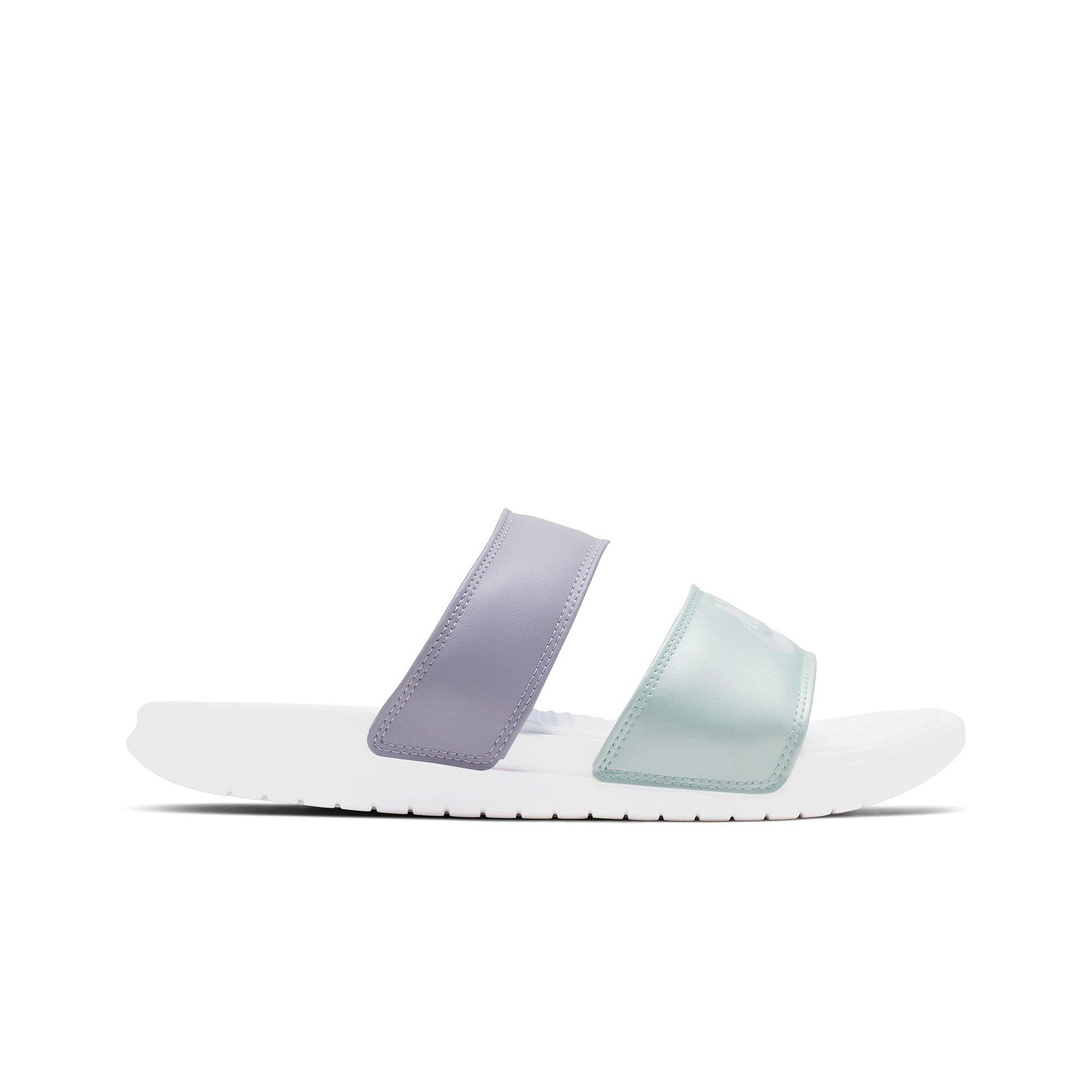 white and teal nike slides