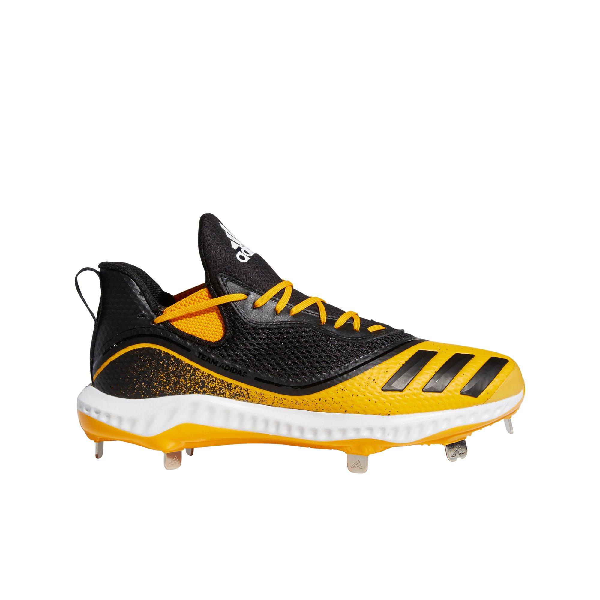 black and yellow adidas cleats