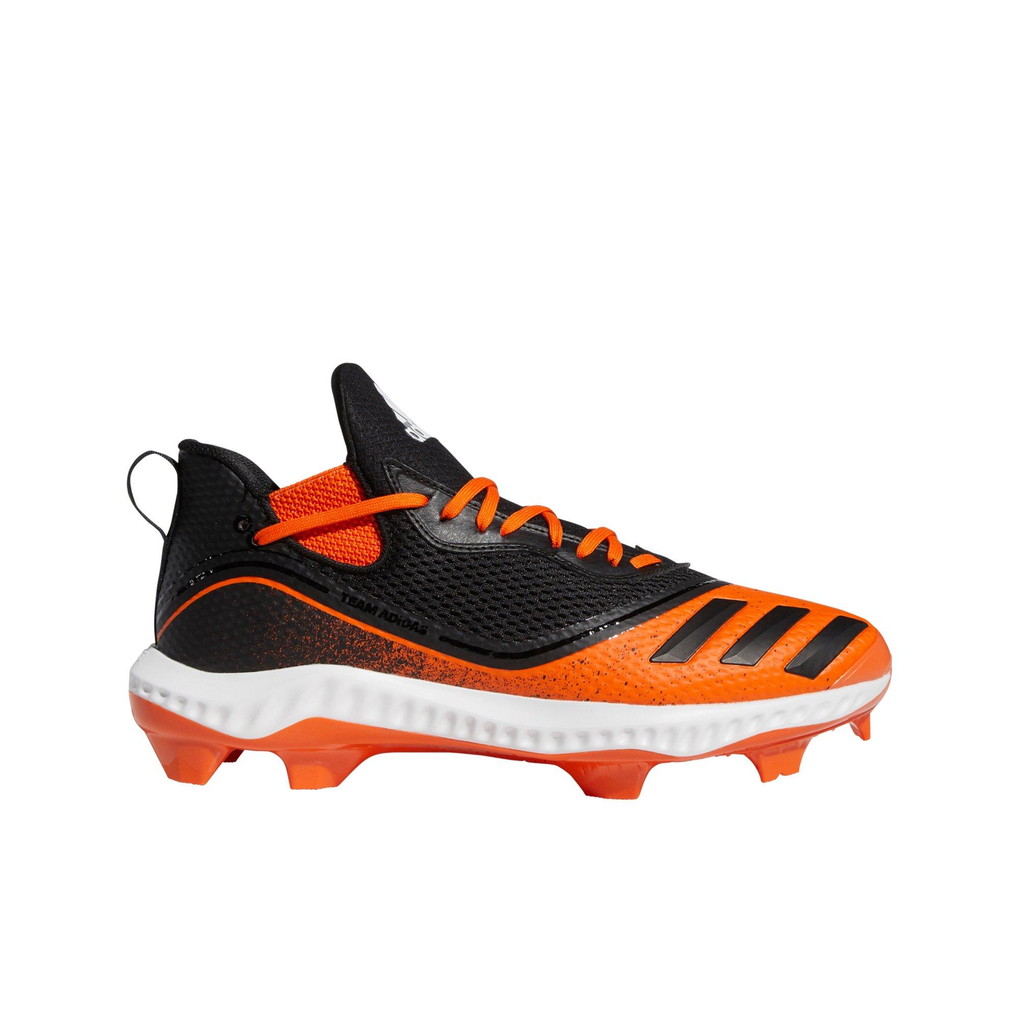 black and orange baseball cleats