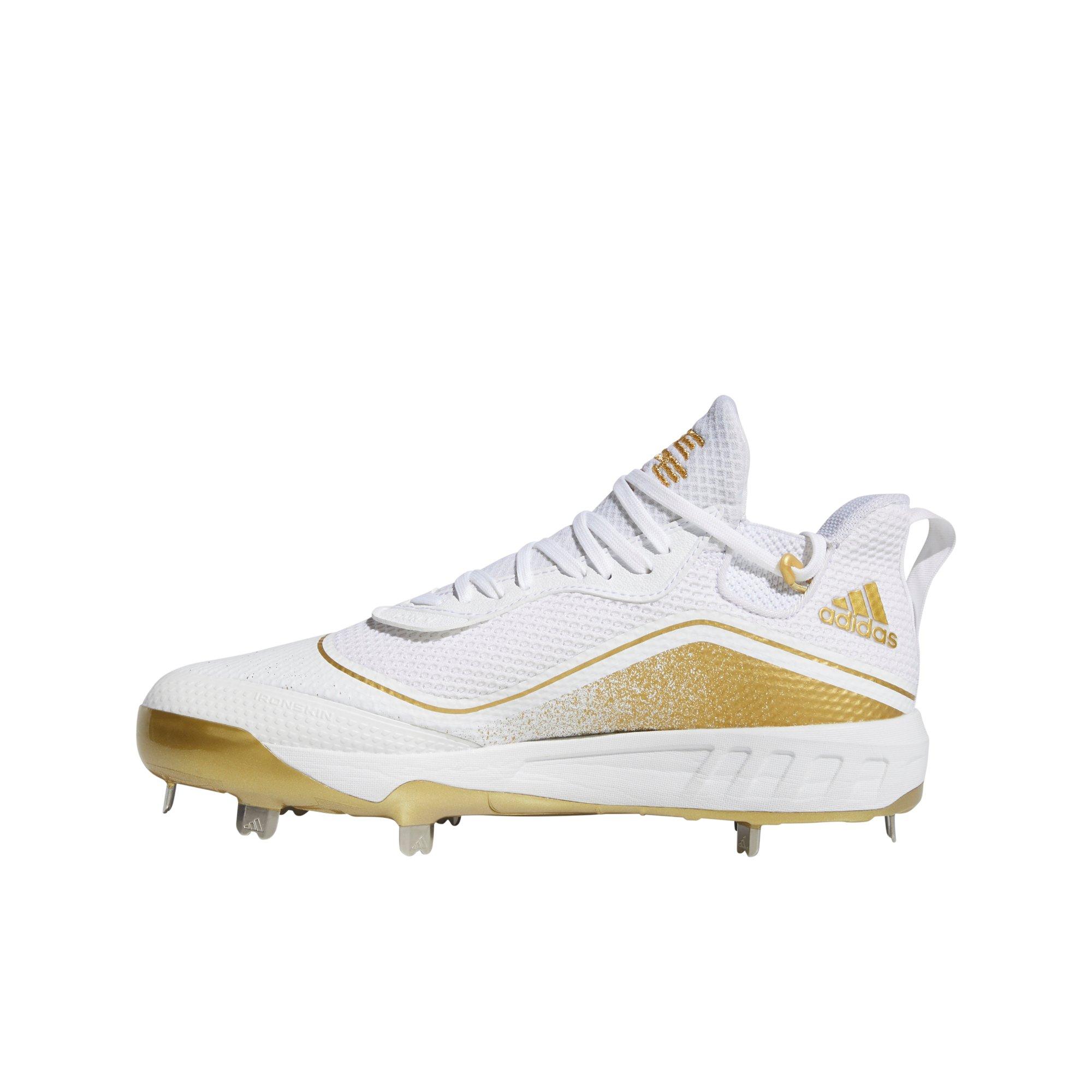 baseball cleats white and gold