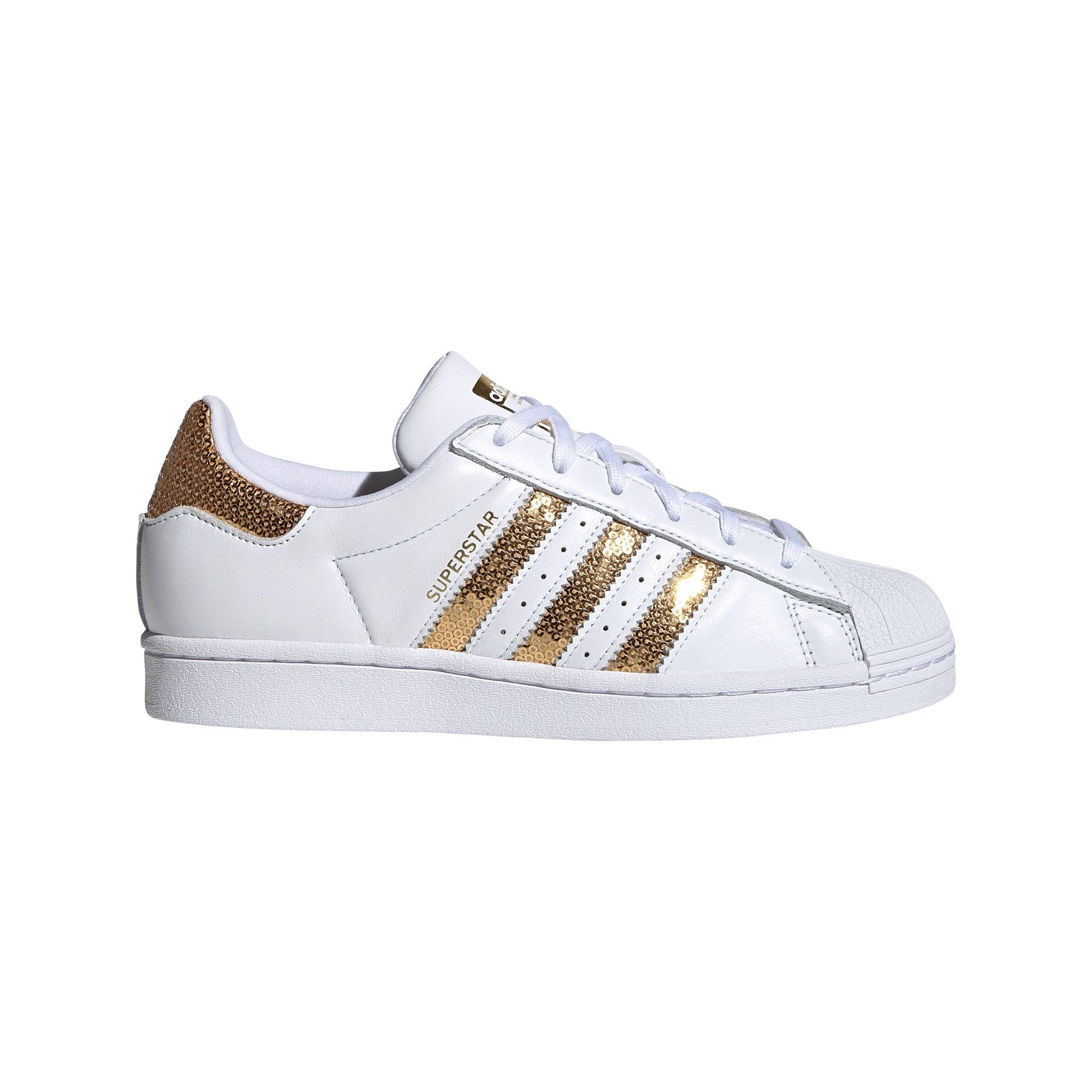 white adidas shoes with gold stripes