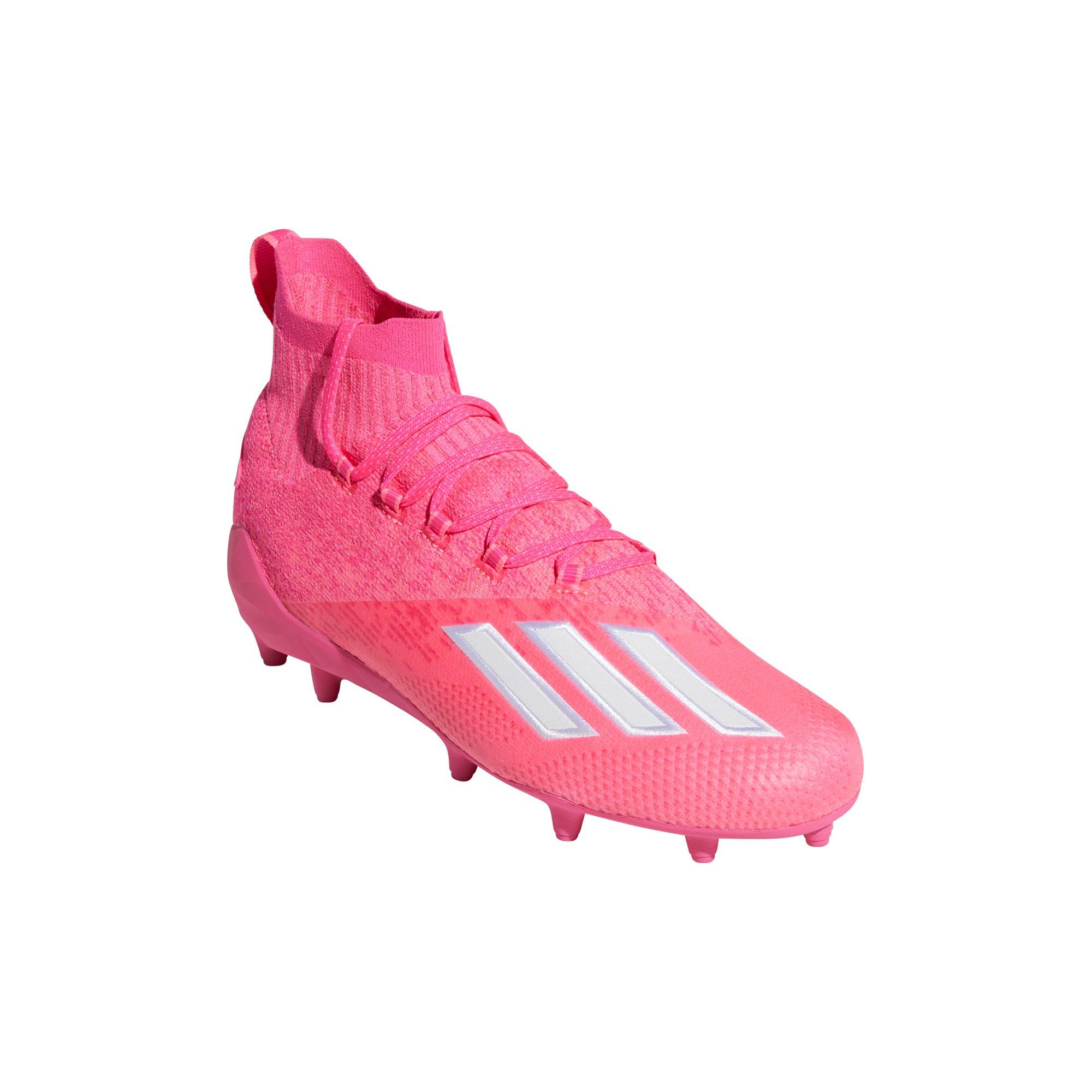 white and pink adidas cleats