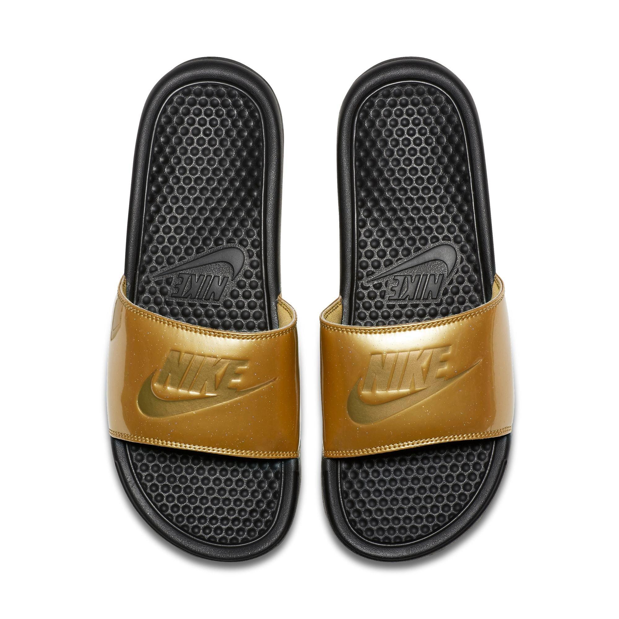 gold and black nike slides