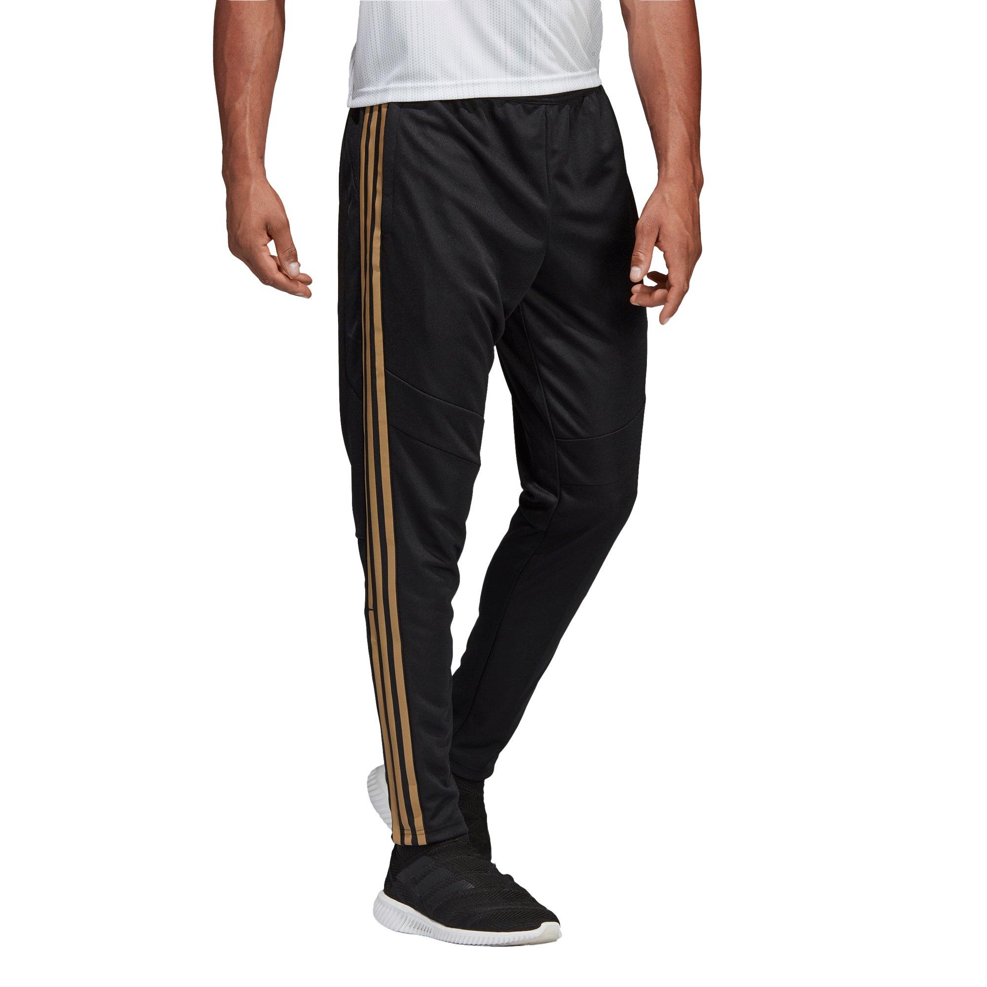 black and gold tiro pants