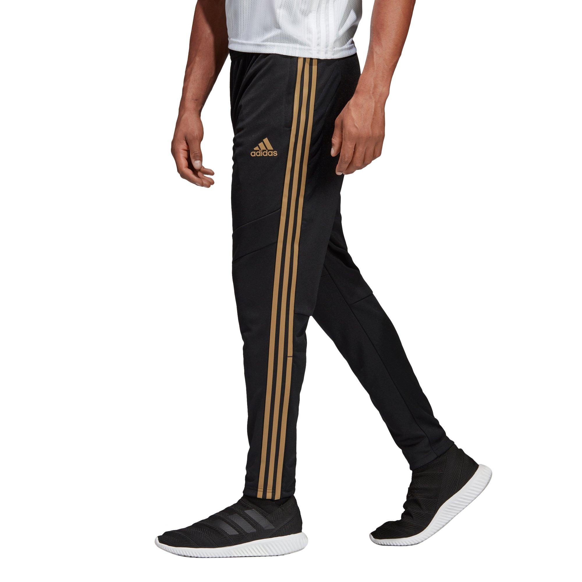 gold and black adidas pants