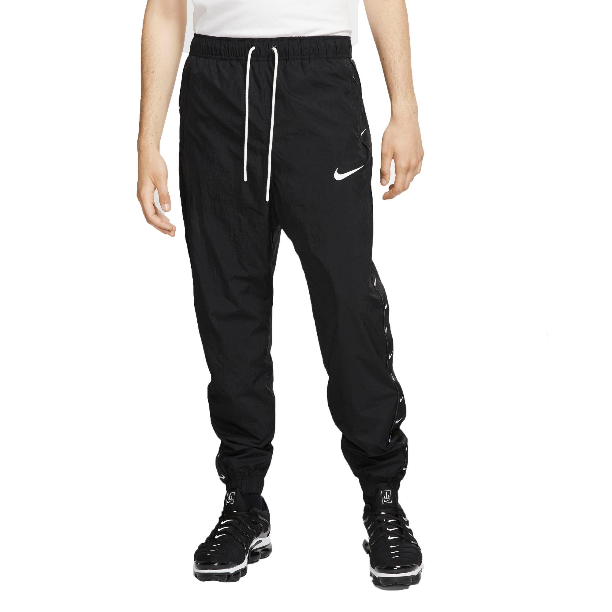 nike swoosh taped track pants