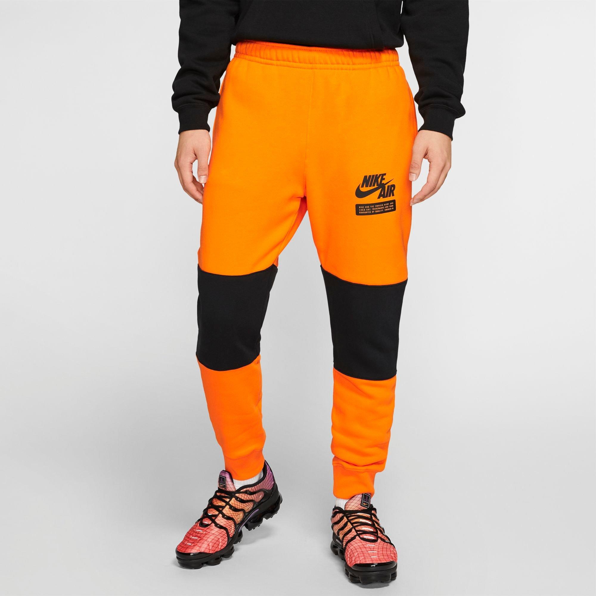 black and orange nike sweatpants