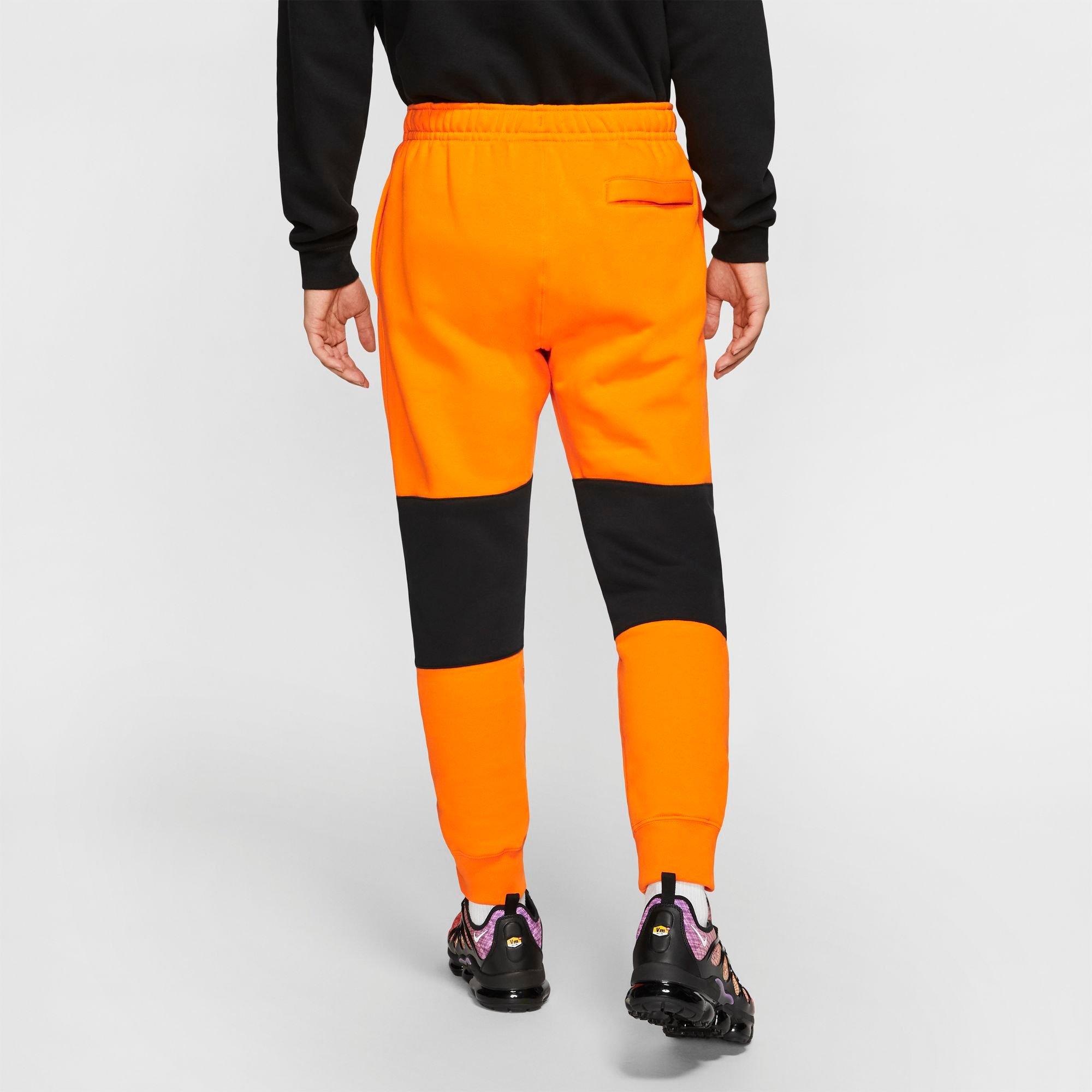 orange nike joggers mens