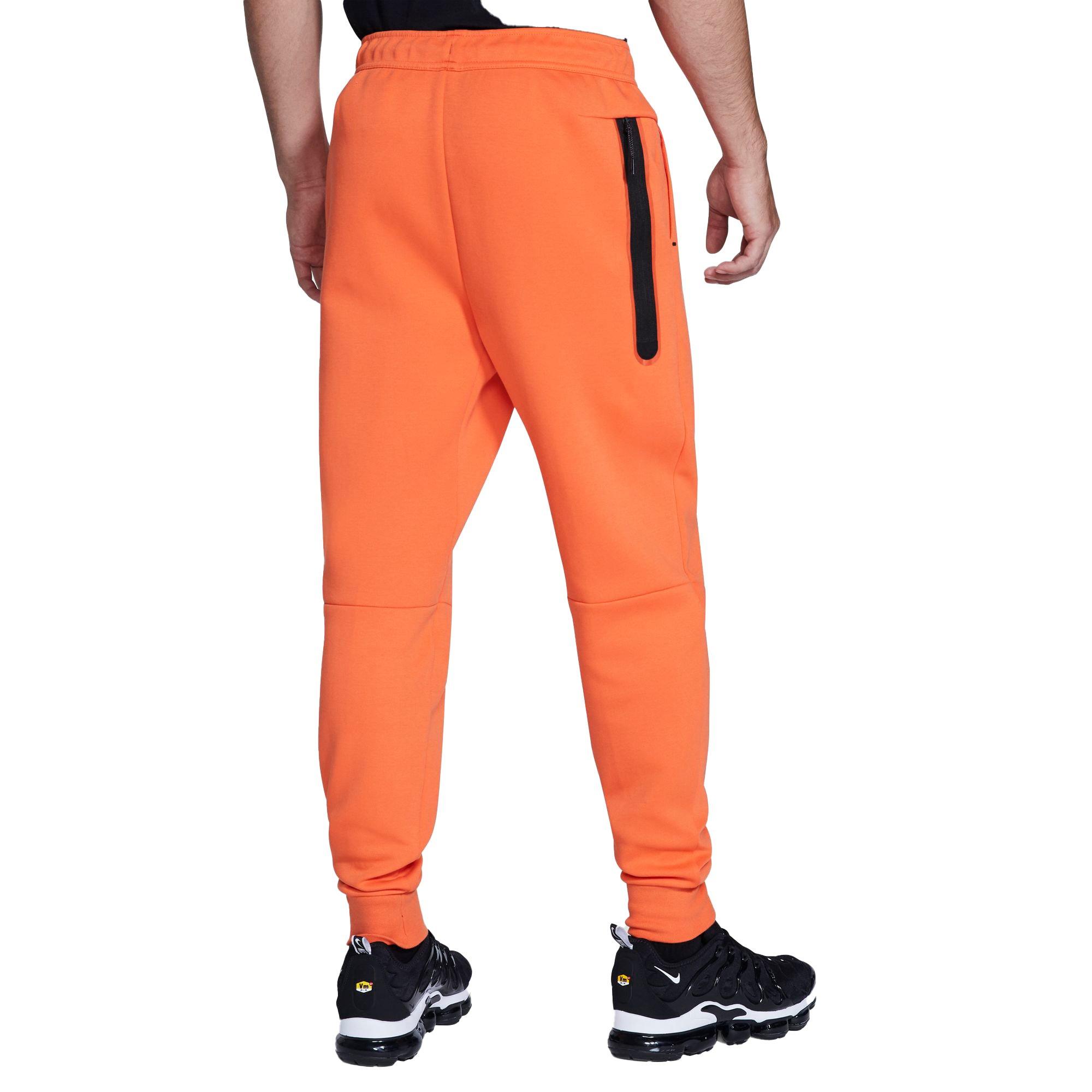 orange nike tech fleece pants 